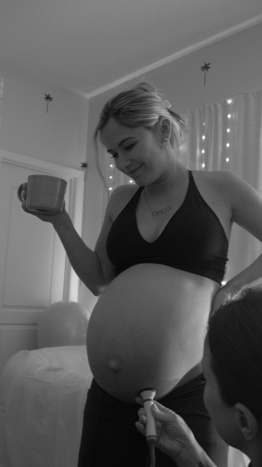 A smiling mother-to-be during a heartbeat check