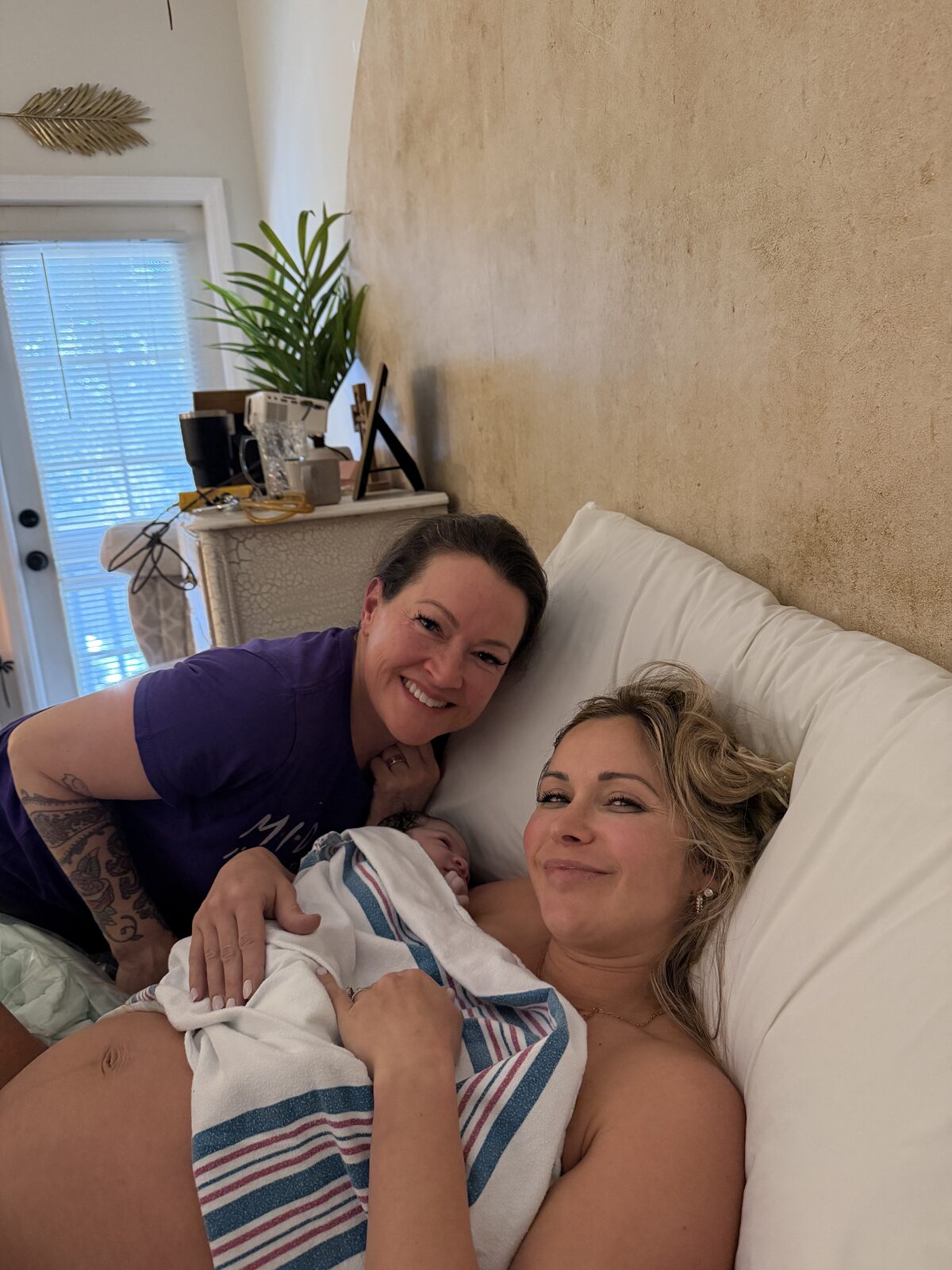 Rhonda with a mother and her newborn resting after birth